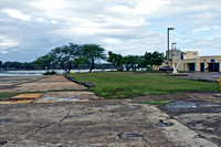 Site on Ford Island (the island in the middle of Pearl Harbor) where the first bomb fell during the attack on Pearl Harbor. The plane came from over those trees and the bomb stuck at the edge of the g