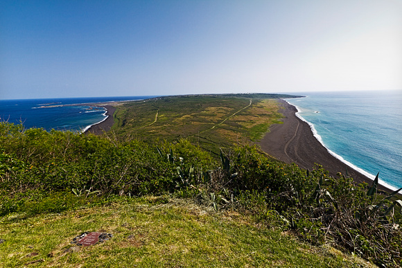 Looking down Iwo Jima from atop Suribachi. The flag went into the ground at that spot in the lower left corner.