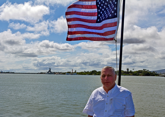Dad on the tail of the USS Bowfin with the Missouri and Arizona in the background